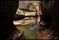 Canyonneer swims in pool, Upper Subway. Zion National Park, Utah ( color)