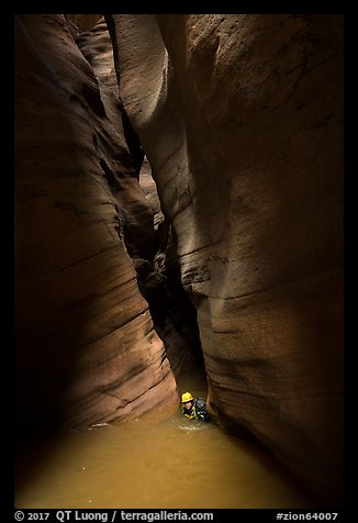 Swimming flooded corridor in Pine Creek Canyon. Zion National Park, Utah (color)