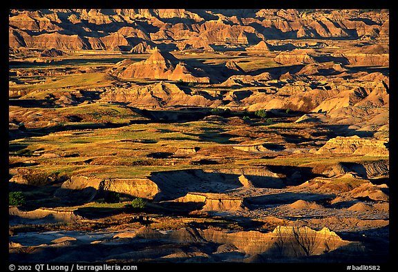 Badland ridges and prairie from above, sunrise. Badlands National Park, South Dakota, USA.