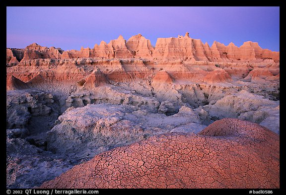 Cracked mud and erosion formations, Cedar Pass, dawn. Badlands National Park, South Dakota, USA.