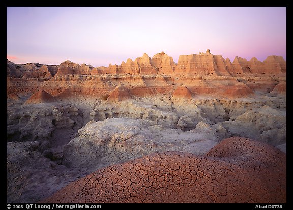 Cracked mudstone and eroded towers near Cedar Pass, dawn. Badlands National Park, South Dakota, USA.