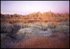 Cracked mudstone and eroded towers near Cedar Pass, dawn. Badlands National Park, South Dakota, USA. (color)