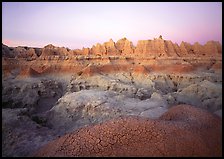 Cracked mudstone and eroded towers near Cedar Pass, dawn. Badlands National Park, South Dakota, USA.