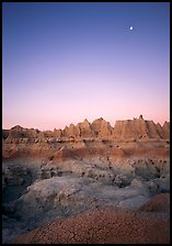 Mud cracks, badlands, and moon at dawn. Badlands National Park ( color)