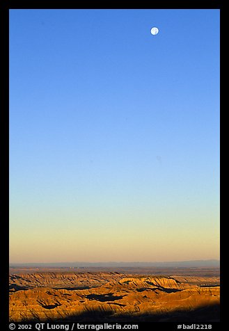 Sky, moon and badlands, sunrise. Badlands National Park, South Dakota, USA.