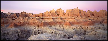 Badlands formations with pastel hues at dawn. Badlands National Park (Panoramic color)