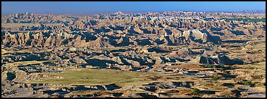 Prairie mixed with badland ridges. Badlands National Park, South Dakota, USA.