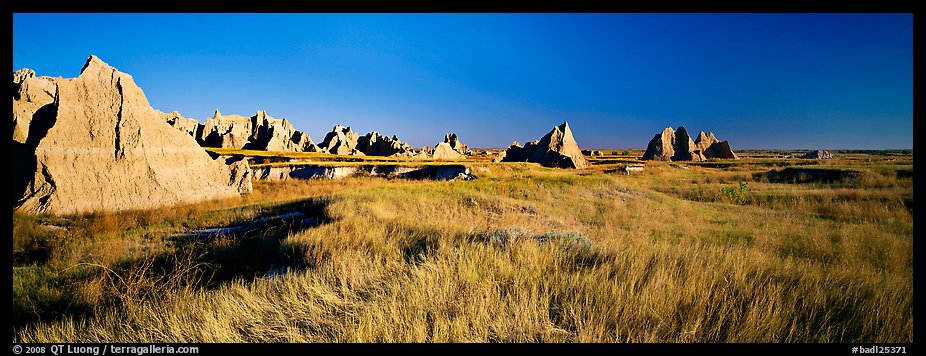 Badlands raising in tall grass prairie landscape, Cedar Pass. Badlands National Park (color)