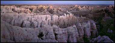 Eroded badland scenery at dusk. Badlands National Park (Panoramic color)