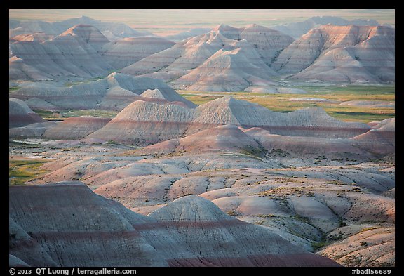 Delicately colored badlands and prairie at sunrise. Badlands National Park, South Dakota, USA.