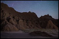 Badlands and star trails. Badlands National Park, South Dakota, USA. (color)