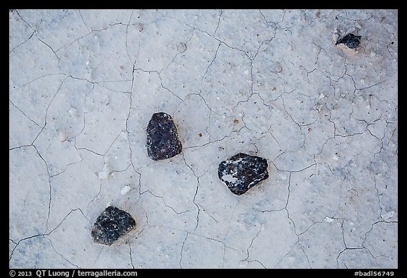 Dark rock on soil with fine cracks. Badlands National Park (color)