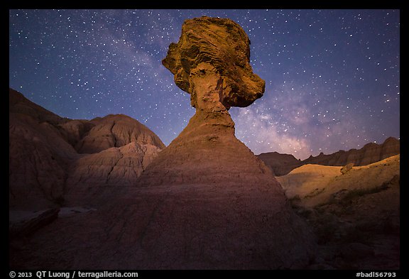 Pillar with caprock, badlands, and Milky Way. Badlands National Park, South Dakota, USA.