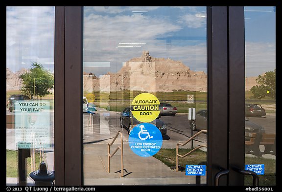 Buttes, Ben Reifel Visitor Center window reflexion. Badlands National Park (color)