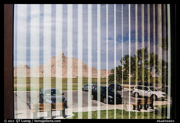Badlands and parking lot, Visitor Center window reflexion. Badlands National Park (color)