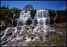 Waterfall at hanging gardens, with top of Mountain. Glacier National Park, Montana, USA. (color)