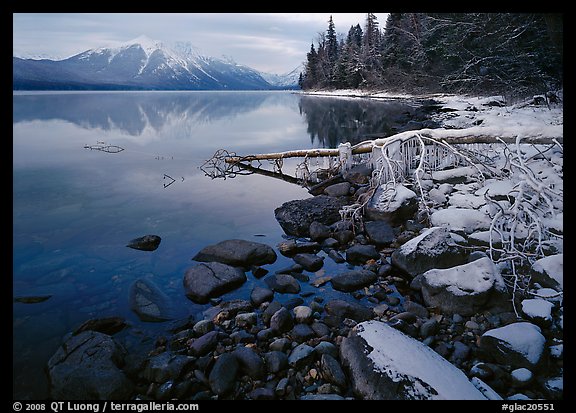 Snowy shoreline of Lake Mc Donald in winter. Glacier National Park, Montana, USA.