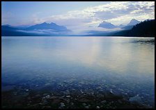 Lake McDonald with clouds and mountains reflected in early morning. Glacier National Park, Montana, USA. (color)