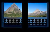 Grinnell Point and Swiftcurrent Lake framed by windows of Many Glacier Lodge. Glacier National Park, Montana, USA.