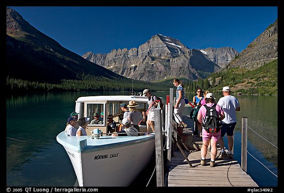 Passengers embarking on tour boat at the end of Lake Josephine. Glacier National Park (color)