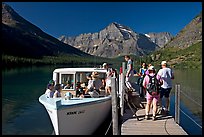 Passengers embarking on tour boat at the end of Lake Josephine. Glacier National Park, Montana, USA.