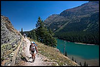 Hikers on trail above Lake Josephine. Glacier National Park, Montana, USA. (color)