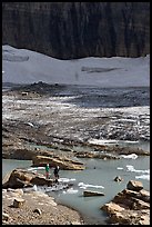 Crossing the outlet stream of the Grinnell glacial lake. Glacier National Park, Montana, USA. (color)