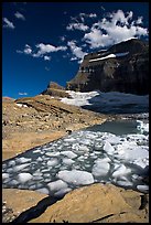 Icebergs in Upper Grinnel Lake, with glacier and Mt Gould in background. Glacier National Park, Montana, USA.