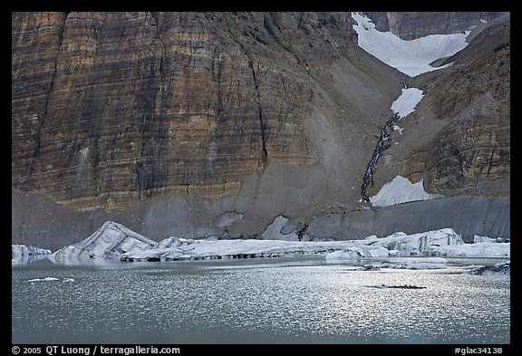 Ripples on Upper Grinnel Lake, with icebergs and glacier. Glacier National Park, Montana, USA.