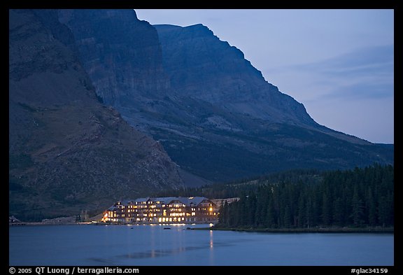 Swiftcurrent Lake and Many Glacier Lodge lights at dusk. Glacier National Park, Montana, USA.