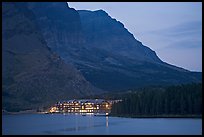 Swiftcurrent Lake and Many Glacier Lodge lights at dusk. Glacier National Park, Montana, USA. (color)