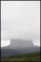 Cloud-covered Chief Mountain. Glacier National Park, Montana, USA.