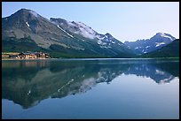 Many Glacier Hotel reflected in Swiftcurrent Lake. Glacier National Park, Montana, USA.