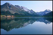 Many Glacier Hotel reflected in Swiftcurrent Lake. Glacier National Park, Montana, USA. (color)