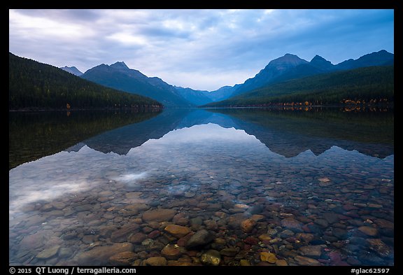 Submerged rocks and mountain reflected, Bowman Lake. Glacier National Park (color)