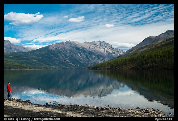 Visitor looking, Kintla Lake. Glacier National Park, Montana, USA.