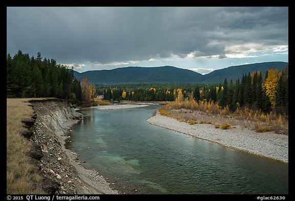 Dark clouds over North Fork of Flathead River in autumn. Glacier National Park, Montana, USA.