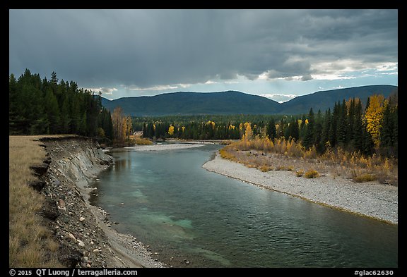 Dark clouds over North Fork of Flathead River in autumn. Glacier National Park (color)