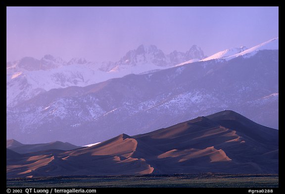 Distant view of the dune field and Sangre de Christo mountains at sunset. Great Sand Dunes National Park and Preserve, Colorado, USA.