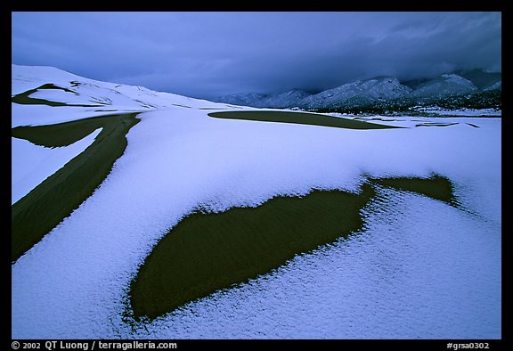 Patch of sand in snow-covered dunes. Great Sand Dunes National Park (color)