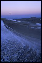 Dunes at dawn with snow and moon. Great Sand Dunes National Park, Colorado, USA. (color)