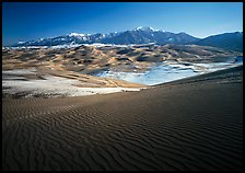 Rippled dunes and Sangre de Christo mountains in winter. Great Sand Dunes National Park, Colorado, USA. (color)