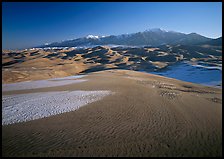 Sand dunes with snow patches and Sangre de Christo range. Great Sand Dunes National Park and Preserve ( color)