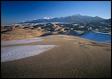 Sand dunes with snow patches and Sangre de Christo range. Great Sand Dunes National Park, Colorado, USA. (color)