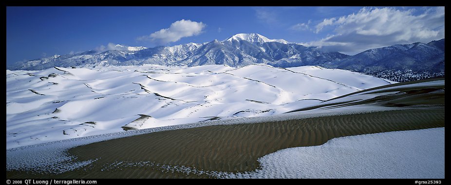 Landscape of snowy dunes and mountains. Great Sand Dunes National Park and Preserve (color)