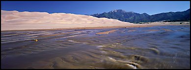 Wide shallow creek at the base of dune field. Great Sand Dunes National Park (Panoramic color)