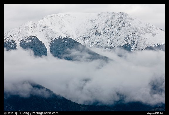 Snowy Sangre de Cristo Mountains above clouds. Great Sand Dunes National Park, Colorado, USA.