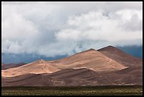 Tall dunes and low clouds. Great Sand Dunes National Park and Preserve, Colorado, USA.