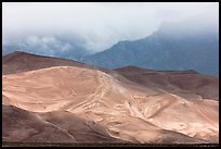 Dunes, ridge and clouds. Great Sand Dunes National Park and Preserve, Colorado, USA.