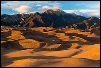 Last light over dune field and Mount Herard. Great Sand Dunes National Park, Colorado, USA. (color)